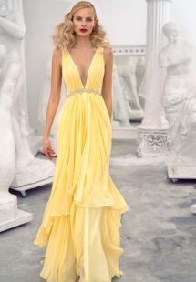 Style #658, chiffon evening dress with a plunging neckline, open back and beaded waistline; available in yellow, ivory, peach, blue, black, smoky, green, azure, cherry, mint, purple, powder