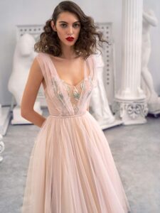 Style #660-1, tulle A-line evening dress with floral embroidered top and flowy skirt; available in midi or maxi length; in ivory-nude, pink-nude
