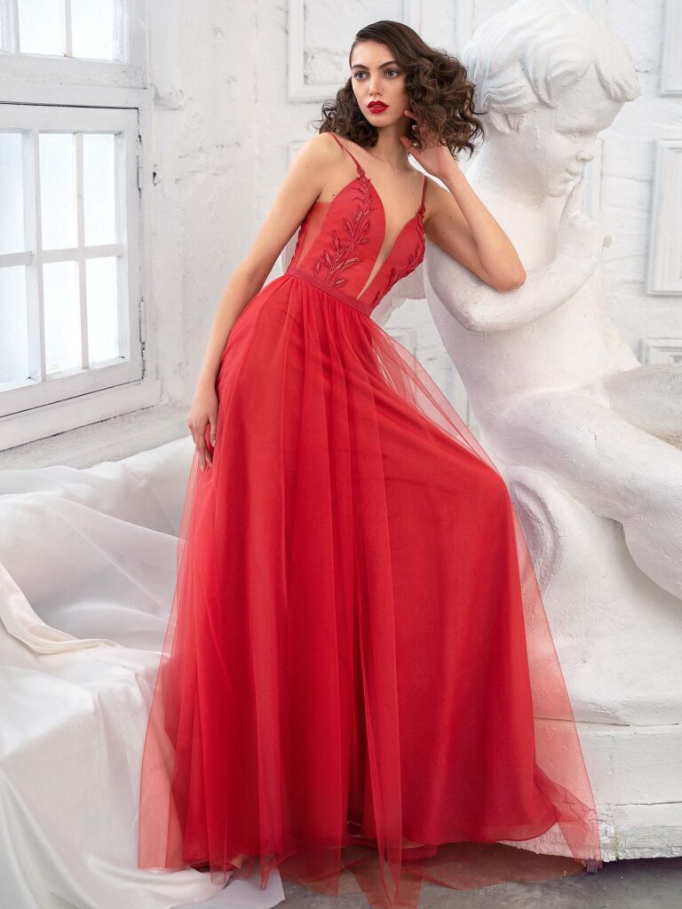 Style #663b, spaghetti strap A-line evening dress with deep plunge neckline and beaded floral embroidery; available in midi or maxi length; in cherry, ivory, purple, azure, black, powder, blue