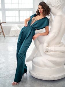 Style #667-8, satin jumpsuit with butterfly sleeves and embroidered top; available in green, burgundy, red, dark blue, ivory, black