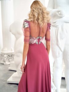 Style #668, short sleeve sheath evening gown with extended shoulders and embroidered top; available in lilac, pink