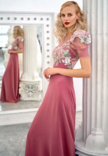 Style #668, short sleeve sheath evening gown with extended shoulders and embroidered top; available in lilac, pink