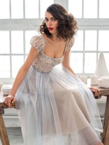 Style #669b, A-line cocktail dress with puffed sleeves and embroidered top; available in maxi length only; in nude-blue