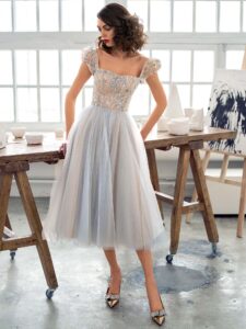 Style #669b, A-line cocktail dress with puffed sleeves and embroidered top; available in maxi length only; in nude-blue