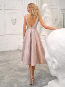 Style #673a, taffeta A-line gown with deep V-neckline and open back; available in midi or maxi length; in gold-grey, gold-orange, orange, purple, fenny, coral, ivory