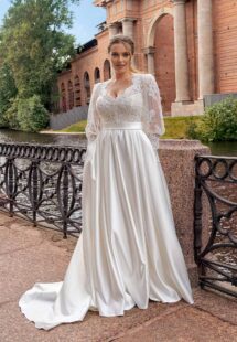 Style #2240L, A-line plus size wedding dress with long lace balloon sleeves; available in ivory