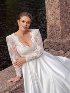 Style #2240L, A-line plus size wedding dress with long lace balloon sleeves; available in ivory