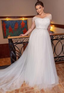 Style #2249, A-line plus size wedding dress with pearl décor and off the shoulder neckline; available in ivory