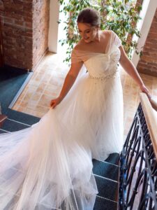 A-line plus size wedding dress with pearl décor and off the shoulder neckline