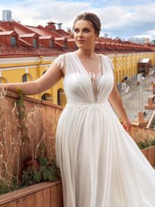 Flowy chiffon plus size wedding dress with cap sleeves