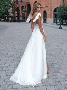 Sheath chiffon wedding dress with double slit skirt; available in ivory-nude