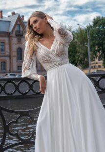 Style #14002, Long sleeve wedding dress with a flowy skirt; available in ivory-nude, ivory