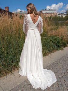 A-line wedding dress with long sleeves and skirt slit