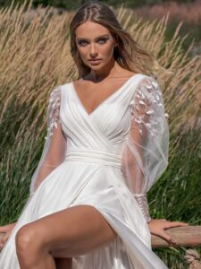 A-line wedding dress with long sleeves and skirt slit