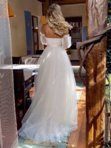 Sequinned lace ballgown wedding dress with detachable bishop sleeves