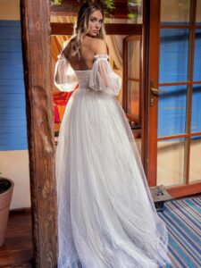 Sequinned lace ballgown wedding dress with detachable bishop sleeves