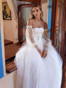 Sequinned lace ballgown wedding dress with detachable bishop sleeves
