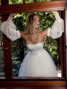 Sequinned lace ballgown wedding dress with detachable bishop sleeves