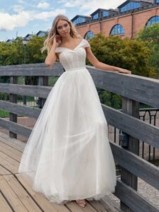 Ballgown wedding dress with an off-the-shoulder neckline and pearl decor