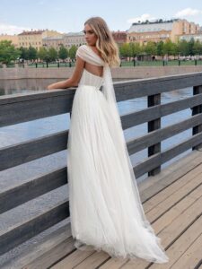 Ballgown wedding dress with an off-the-shoulder neckline and pearl decor