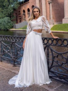 Two-piece bridal set with lace long-sleeve crop top and flowy chiffon skirt