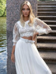 Two-piece bridal set with lace long-sleeve crop top and flowy chiffon skirt