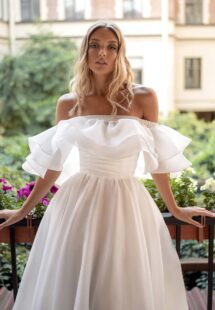 Style #14015, Strapless A-line wedding dress with detachable off-the-shoulder capelet; available in ivory