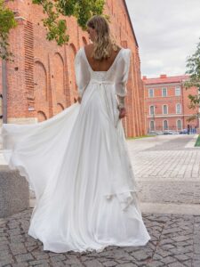 Long-sleeve sheath wedding dress with bustier style corset