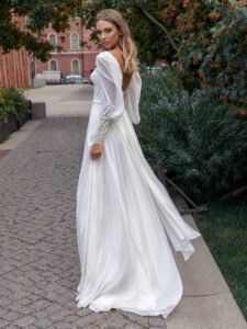 Long-sleeve sheath wedding dress with bustier style corset