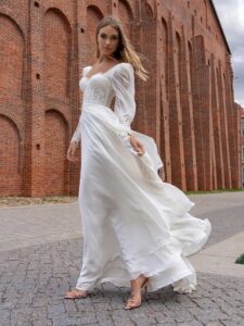 Long-sleeve sheath wedding dress with bustier style corset