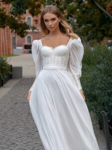 Long-sleeve sheath wedding dress with bustier style corset