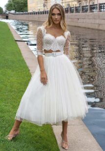 Styles #14019-3 and 14019-2a, Lace bridal crop top with a tulle tea-length skirt; available in ivory