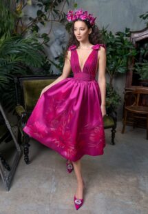 Style #706a, A-line floral print cocktail dress with V-neck draped bodice and bow accents; available in midi or maxi length; in fuchsia, mint