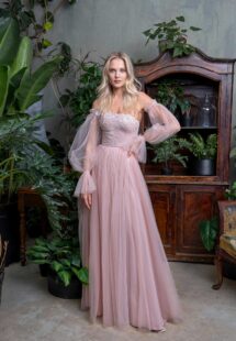 Style #710, tulle A-line evening dress with asymmetrical neckline and long bishop sleeves; available in powder, pink, cherry, grey-blue