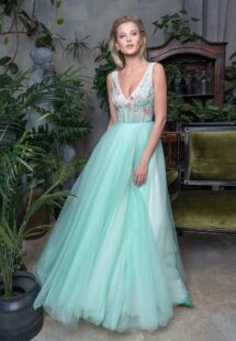 Style #716b, full skirt evening dress with floral V-neck bodice; comes with a detachable long-sleeve tulle overlay blouse; available in midi or maxi length; in cornflower, green-yellow, crimson, powder, blue, pink, cherry, black, ivory