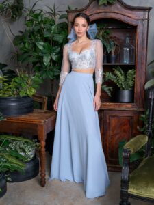 Style #725b, two-piece 3/4 sleeve crop top and long chiffon skirt set; available in blue, black, ivory
