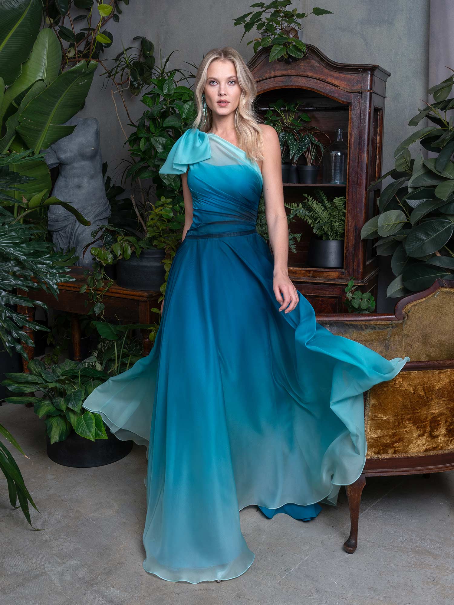 Style #732, A-line ombre evening dress with draped one-sleeve bodice and a bow; available in emerald, lavender