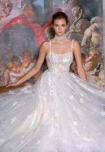 Style #2300L, floral ballgown wedding dress with a straight neckline and spaghetti straps; available in ivory