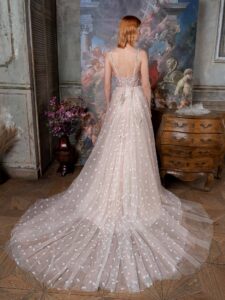 Pale blush A-line wedding dress with bustier style corset and 3D flower embroidery; available in ivory-powder, ivory