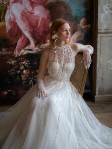 Vertical stripe lace A-line wedding dress with illusion halter neckline over a bustier style corset