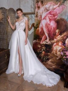 One-shoulder ballgown wedding dress with lace bodice and organza slit skirt