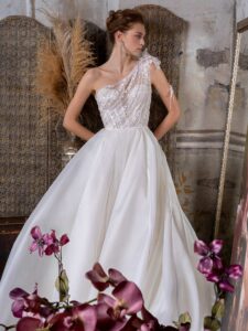 One-shoulder ballgown wedding dress with lace bodice and organza slit skirt