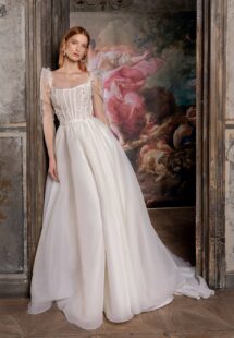 Style #2306L, square neck organza ballgown with puffed long sleeves and floral applique; available in ivory