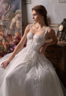 Style #2308L, A-line wedding dress with thick straps, plunging bustier-style bodice and floral applique; available in ivory