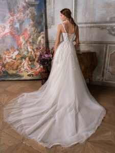 A-line wedding dress with thick straps, plunging bustier-style bodice and floral applique