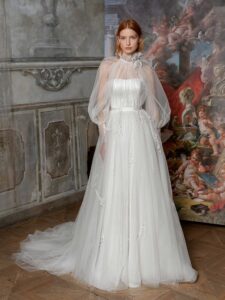 High-neck tulle ballgown with bishop sleeves and beaded floral applique