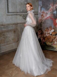 High-neck tulle ballgown with bishop sleeves and beaded floral applique