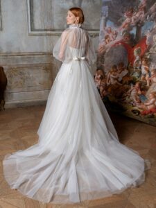 High-neck tulle ballgown with bishop sleeves and beaded floral applique