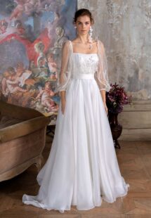 Style #2310L, square neck A-line wedding dress with floral long-sleeve bodice and organza skirt; available in ivory