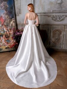 Strapless Mikado ballgown with a bustier-style bodice, lace embroidery and buttons down the skirt
